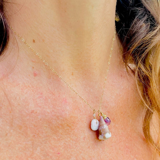 Hawaiian shells and an amethyst faceted gemston dangle like charms from a 14k gold-filled dainty chain.