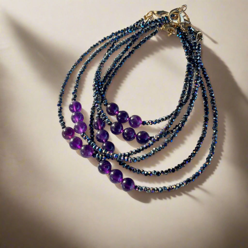 Amethyst Anklets in natural light with crystal beads in a dark color