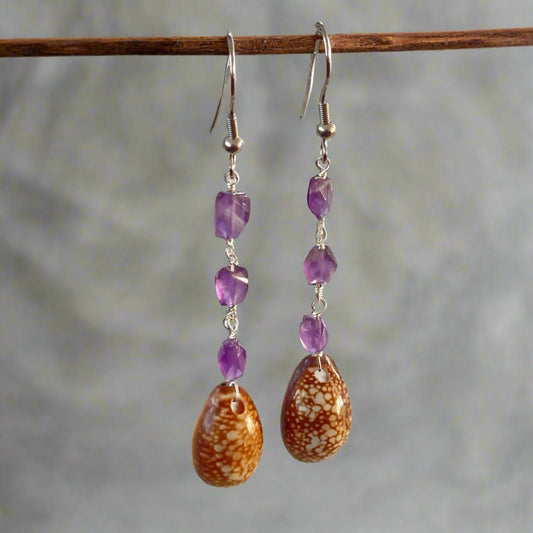 Faceted amethyst link chain with a Hawaiian cowry shell dangle earrings.