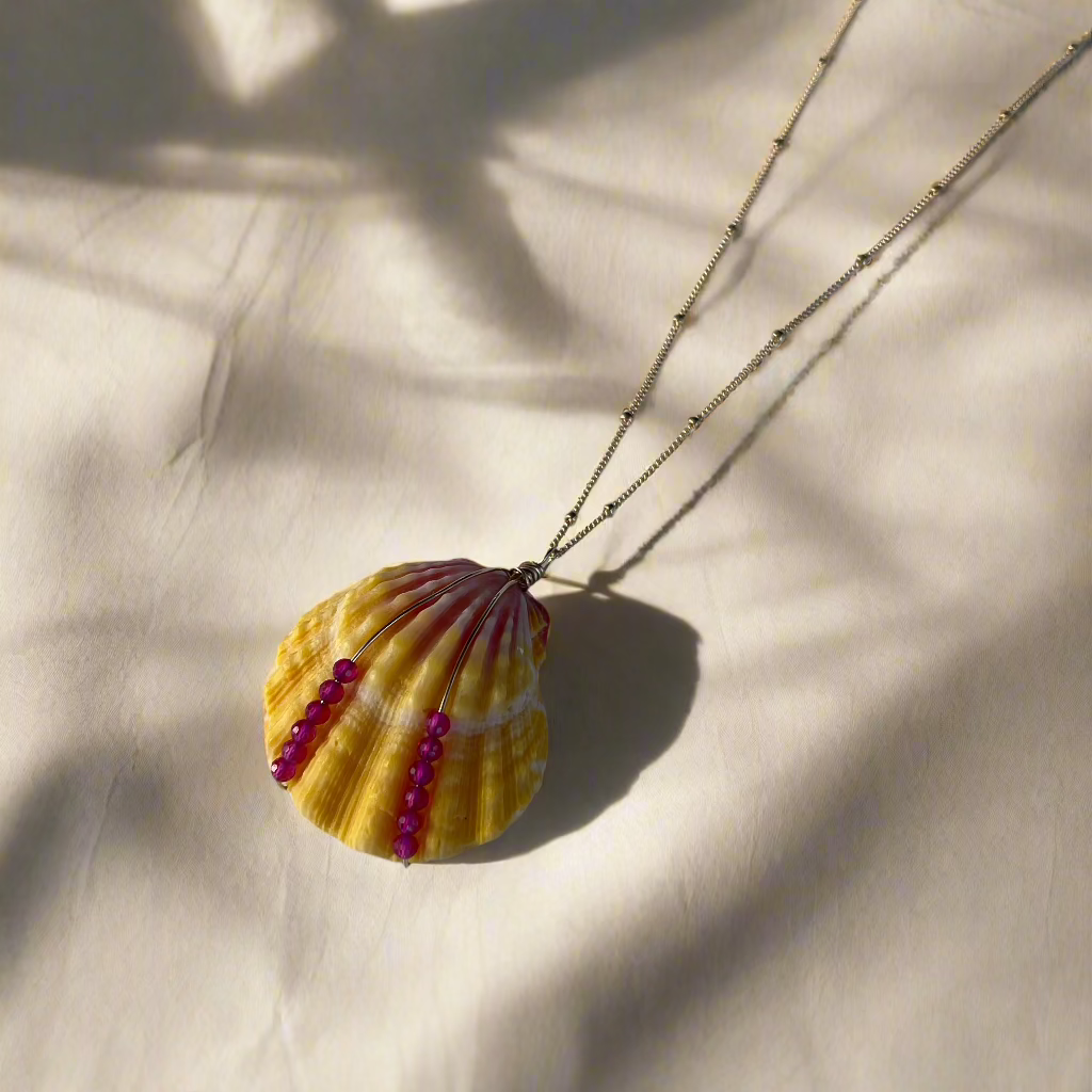 Pink rubies and a Hawaiian sunrise shell pendant on a 14k gold-filled chain